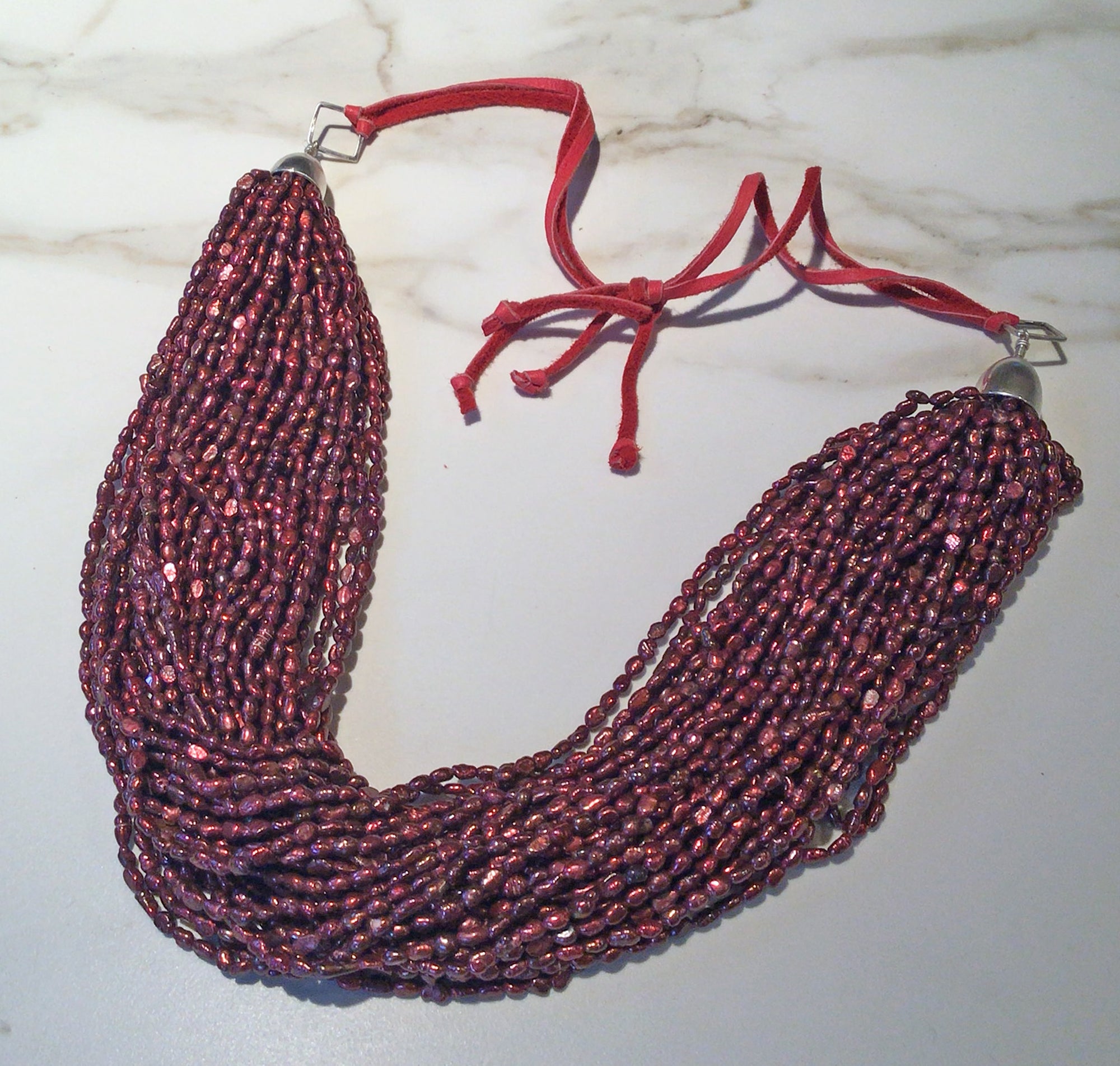 RED FRESHWATER PEARL TORSADE  WITH SILVER ON PINK LEATHER