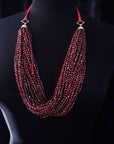 RED FRESHWATER PEARL TORSADE  WITH SILVER ON PINK LEATHER